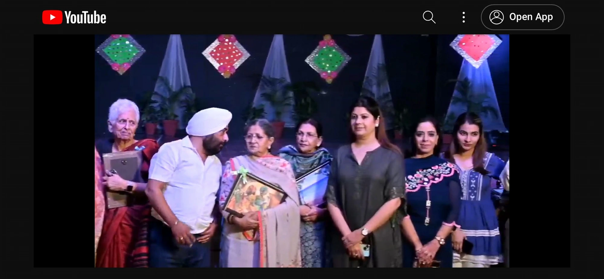 Manjit Kaur on stage at a cultural event