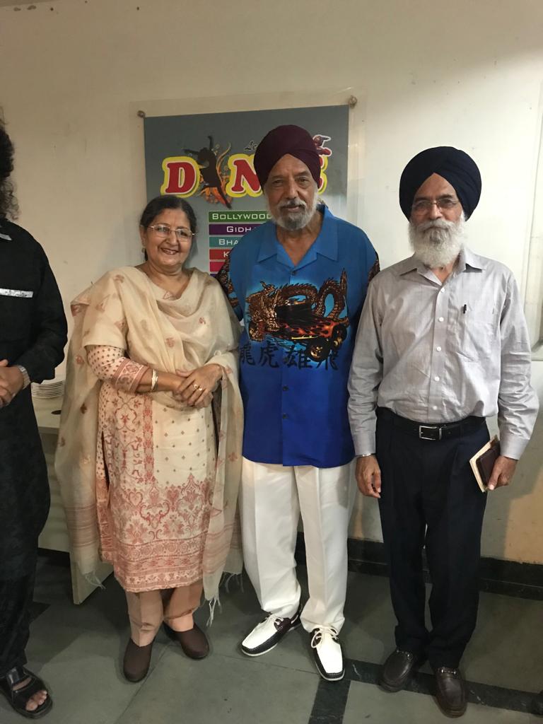 A felicitation ceremony — rows of honoured elders